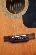 Why does my guitar buzz - examining bridge and strings