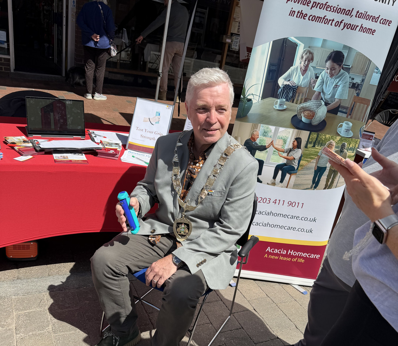 Steve Ringham at Acacia Homecare booth For Egham Magna Carter Day