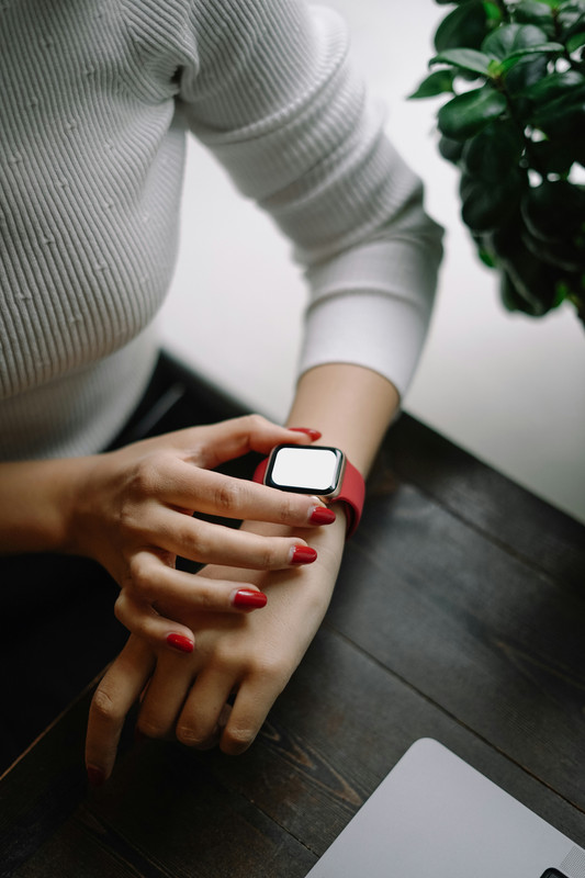 woman checking smart watch