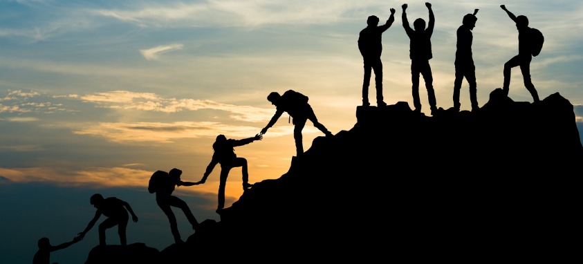 group-of-people-on-peak-mountain-climbing-helping-team-work-travel-picture-id1009803562.jpg