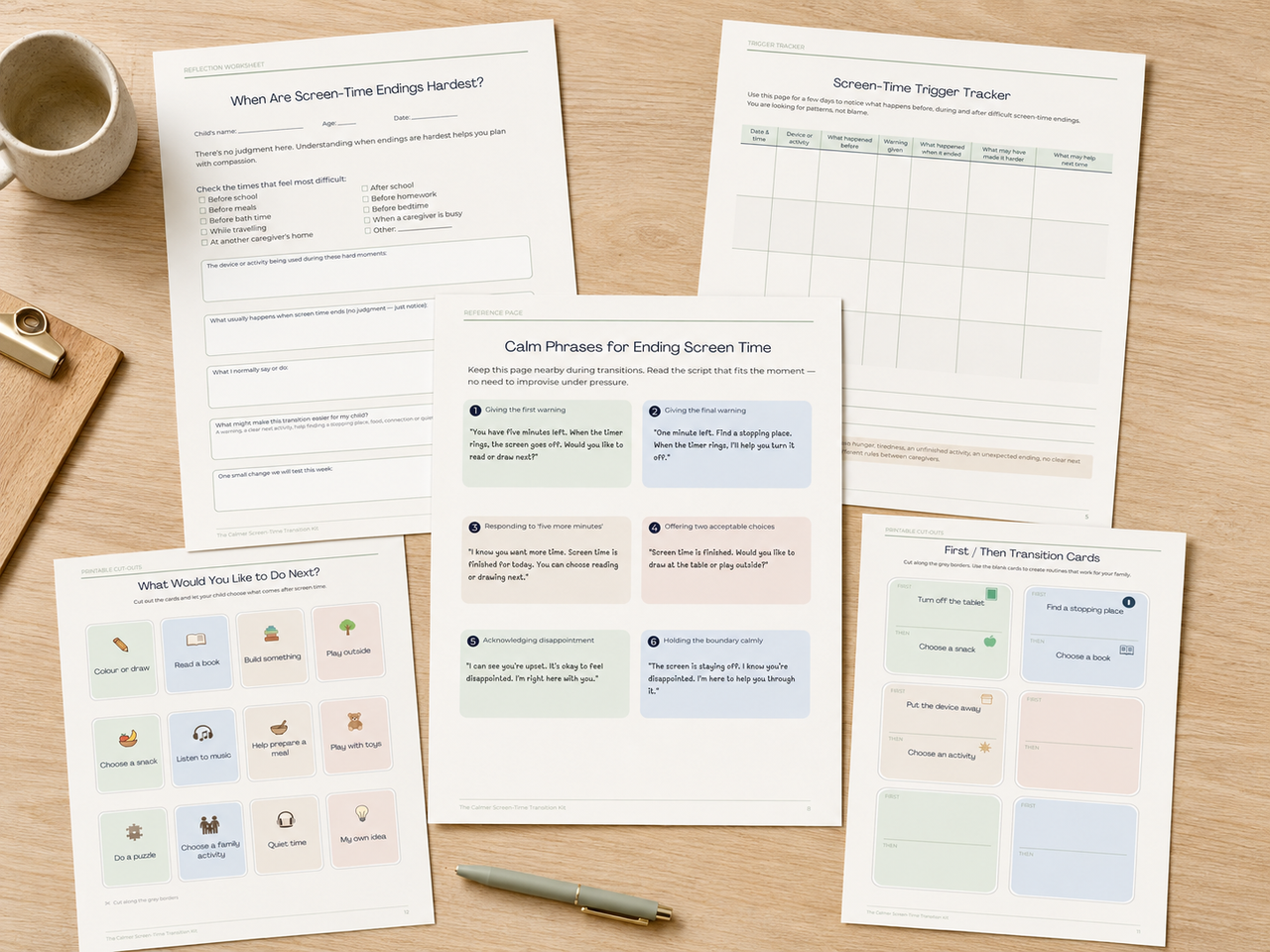 Printed toolkit worksheets and cards arranged on a desk