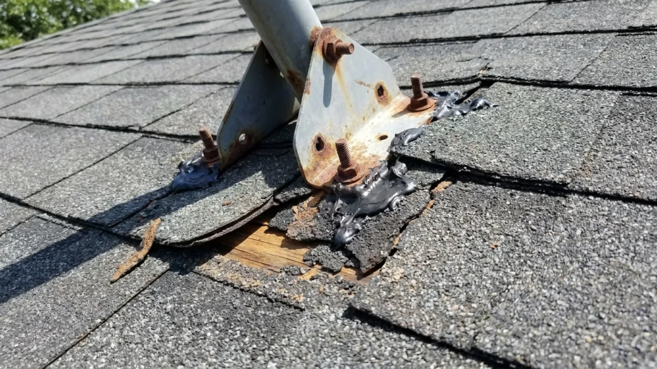 Satellite dish installation on roof voiding warranty San Antonio home