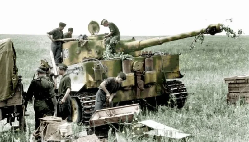 Tiger-tank-reloaded-with-ammunition-by-its-crew-in-the-rear-areas-during-Operation-Zitadelle.webp