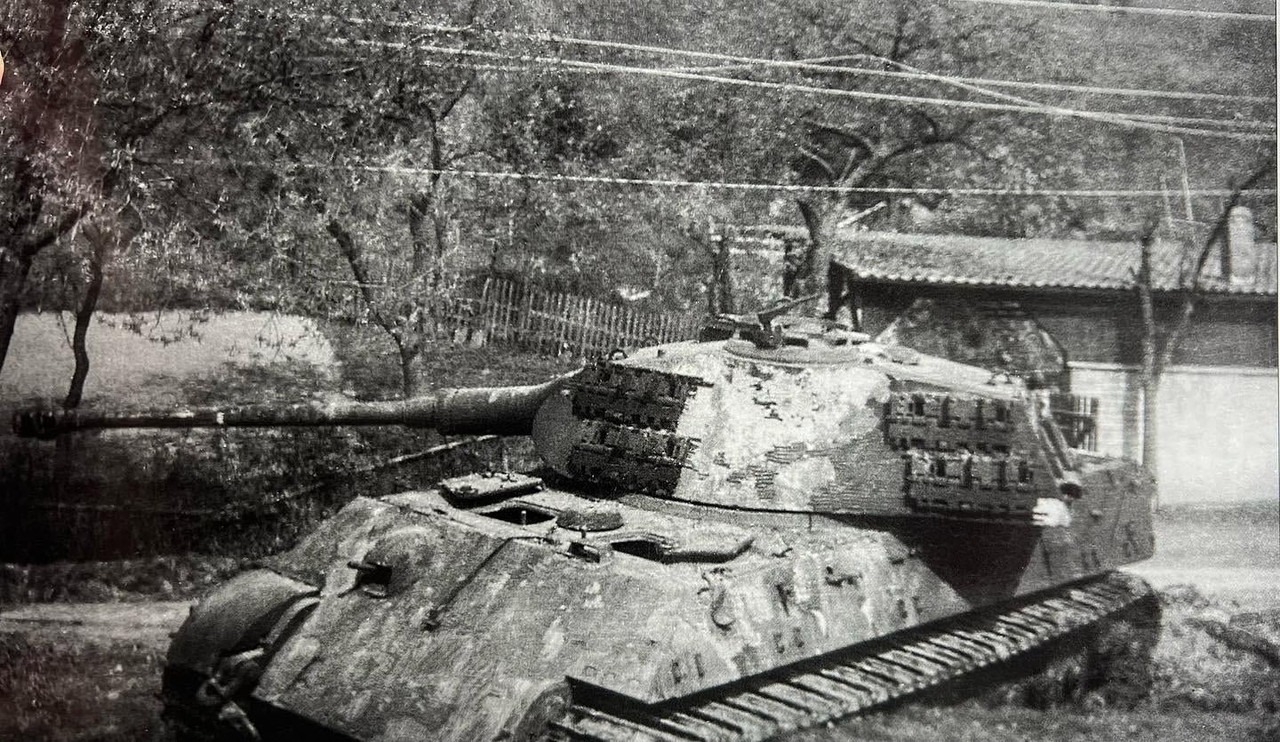 These two show the 506th Abteilung Tiger II in Dörnholthausen after the dozer has moved it off the r