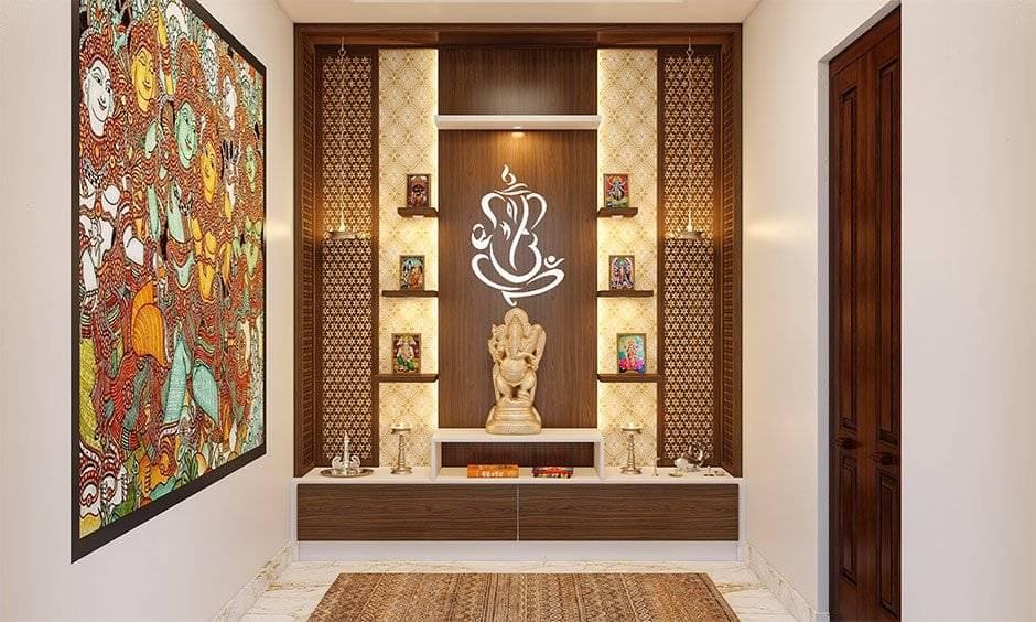 Elegant pooja mandir with intricate carvings and warm golden lighting.