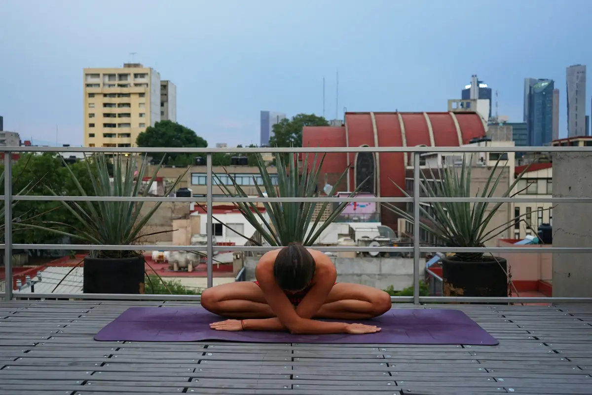 Woman stretching and relaxing after workout in natural light