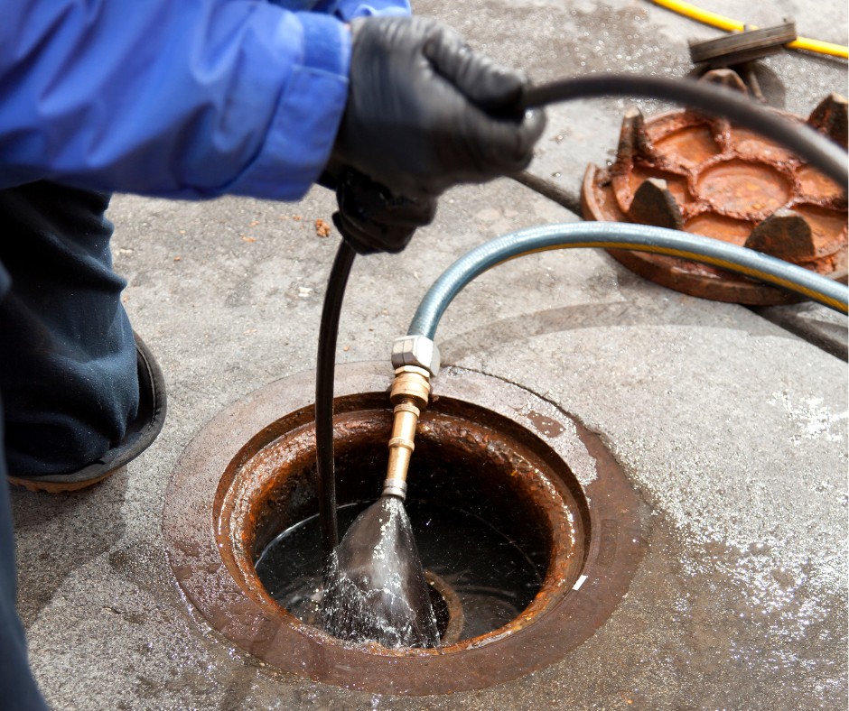 Hydro jetting drain cleaning equipment blasting grease and debris in Albuquerque