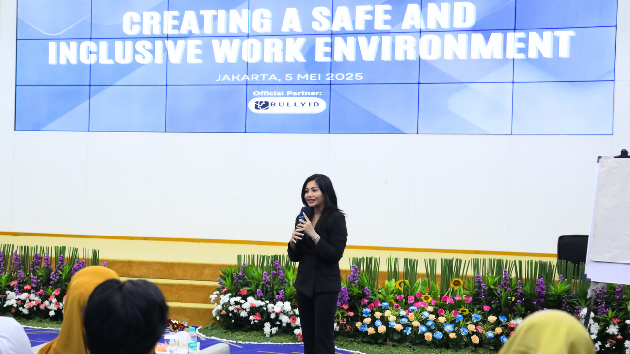 Professional woman presenting a safe and inclusive work environment webinar