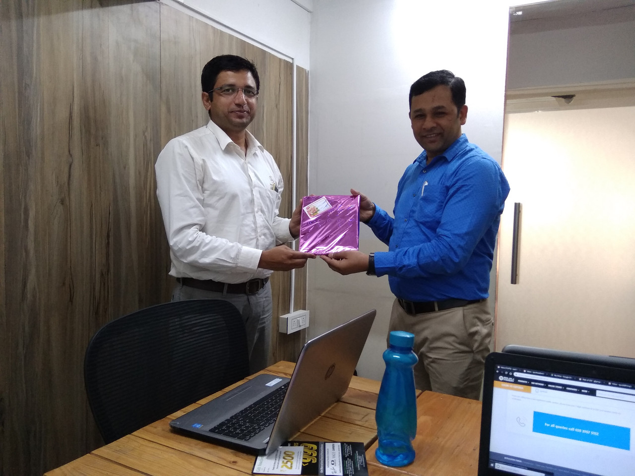 Anil Hanegave with a Trading Direction team member at the Pune office