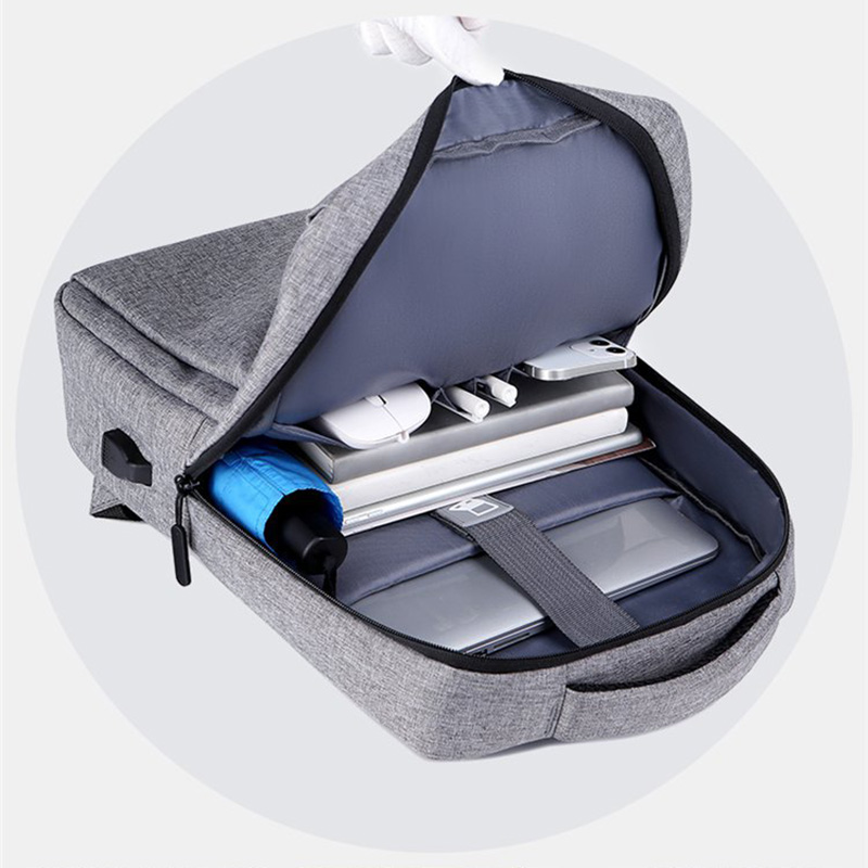 2026 hot-selling custom slim business laptop backpack with USB charging port placed on luggage case, featured as best B2B corporate gift choice