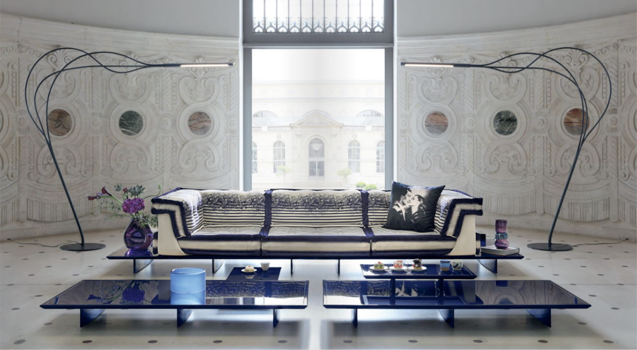 Symmetrical living room composition with blue and white accents.