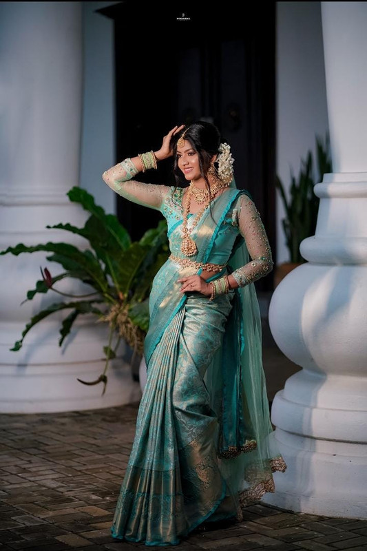 Bride in teal saree — full length bridal portrait