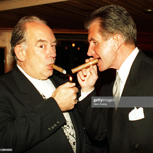 George Hamilton smoking a cigarette (or weed)
