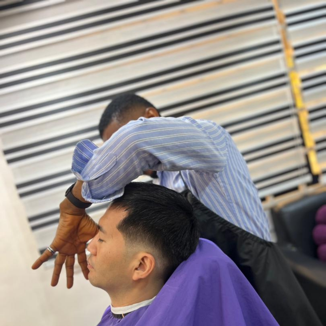 Sharp parting and scissor detail on Asian client