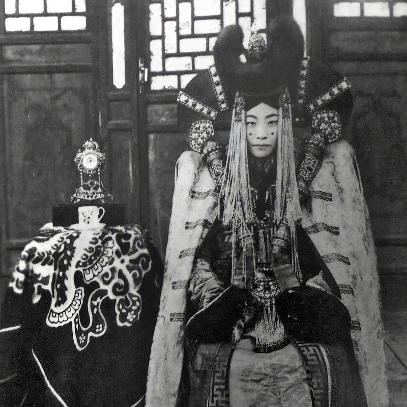A-Mongolian-lady-sits-for-her-portrait-before-a-Chinese-photographer