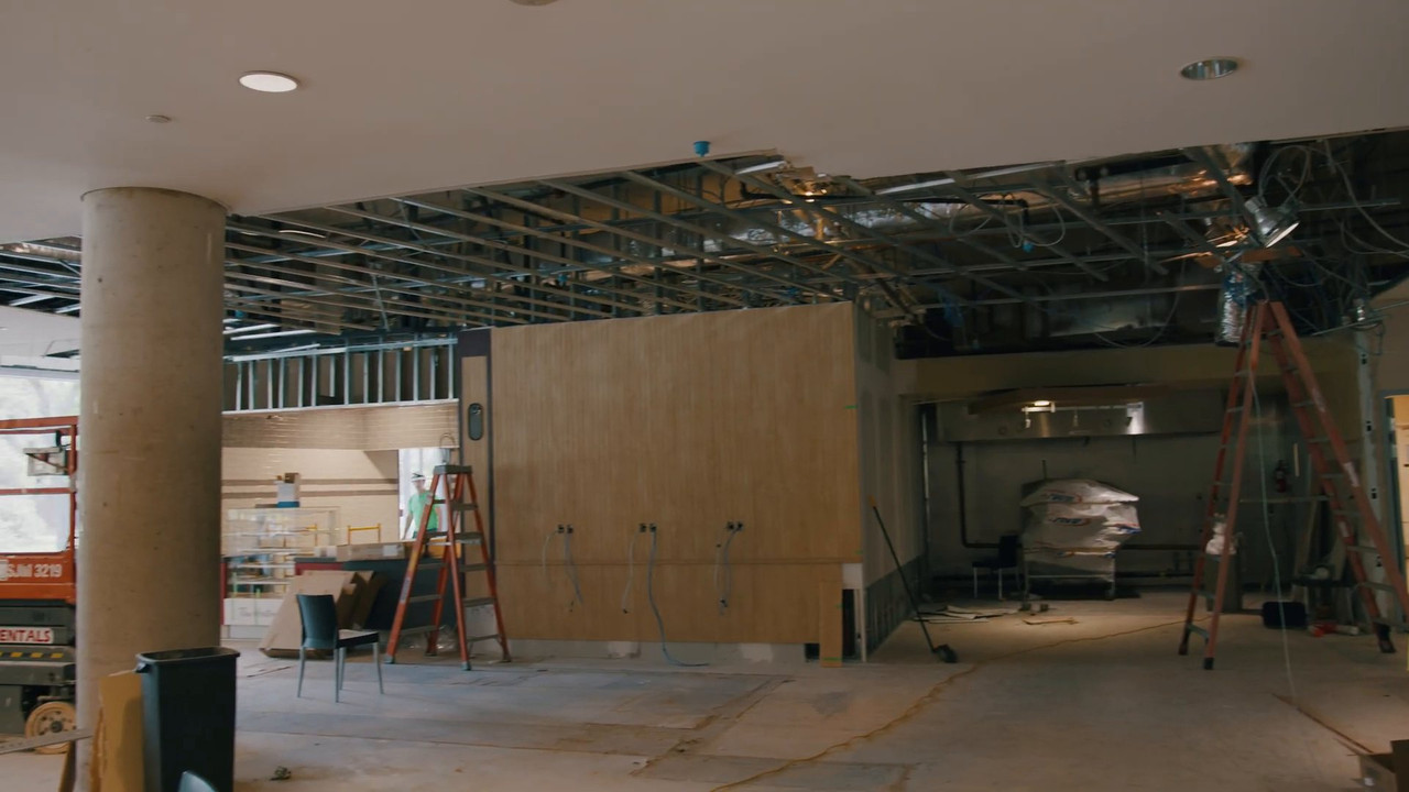 Tim Hortons unit mid-renovation with open ceiling and new millwork walls
