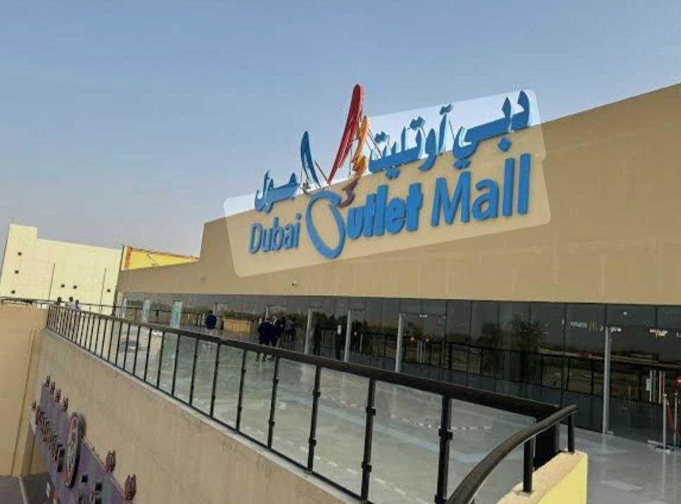 Exterior view of Dubai Outlet Mall showcasing the main entrance and shopping facade