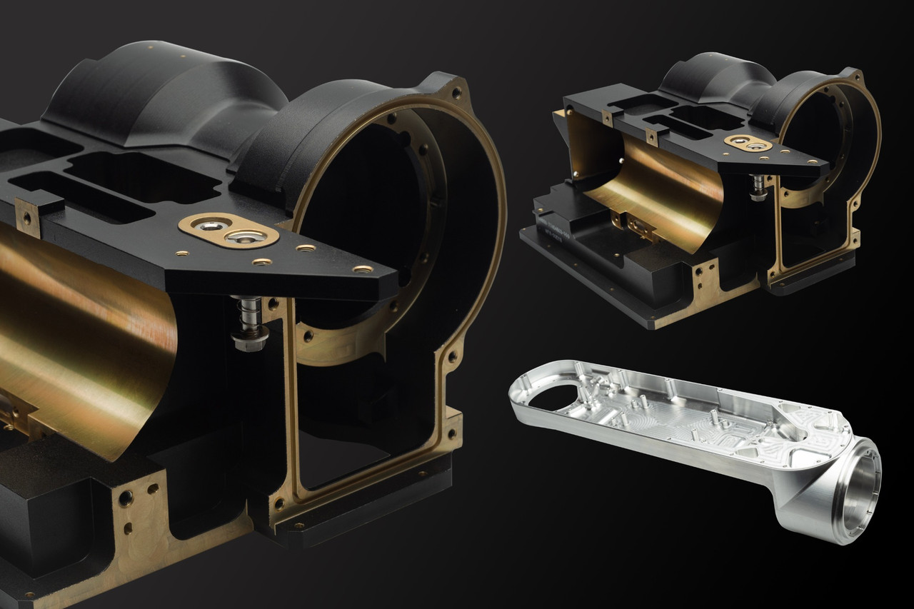 Industrial machined parts photographed on a dark background for Chicago product photography