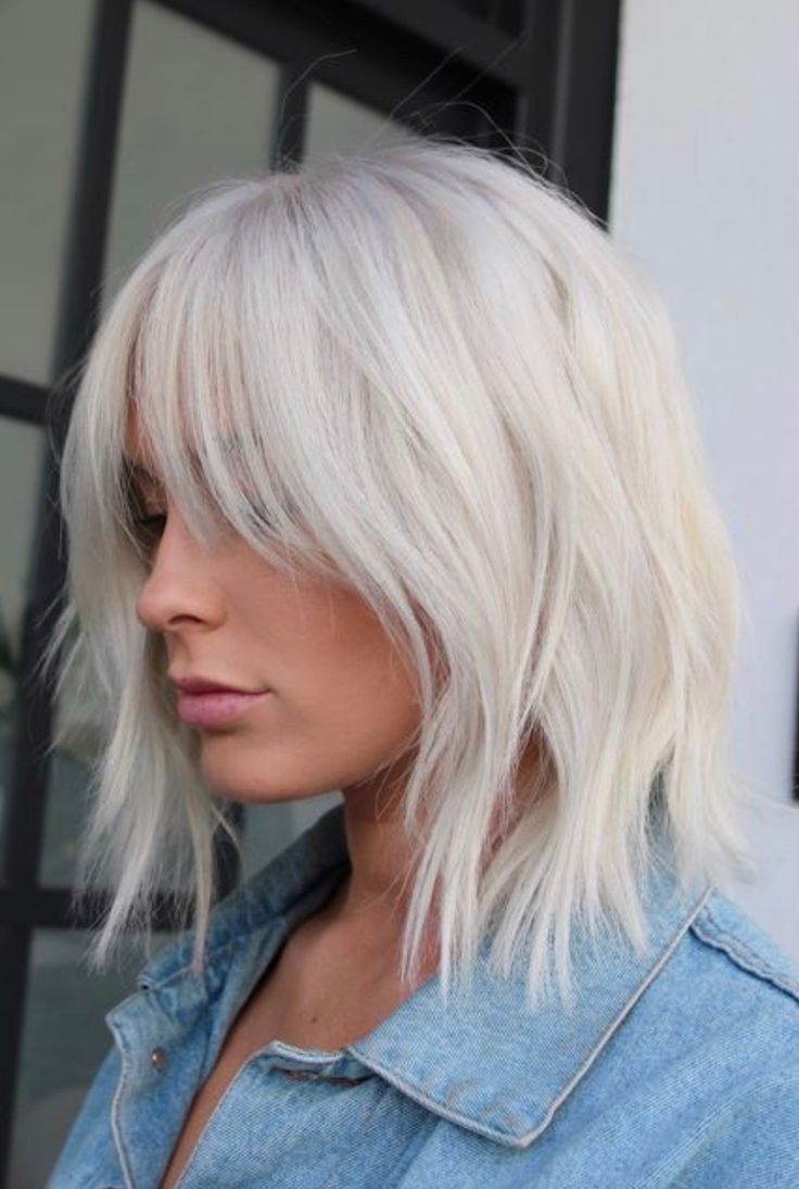 Blonde shoulder length shaggy spiky octopus haircut