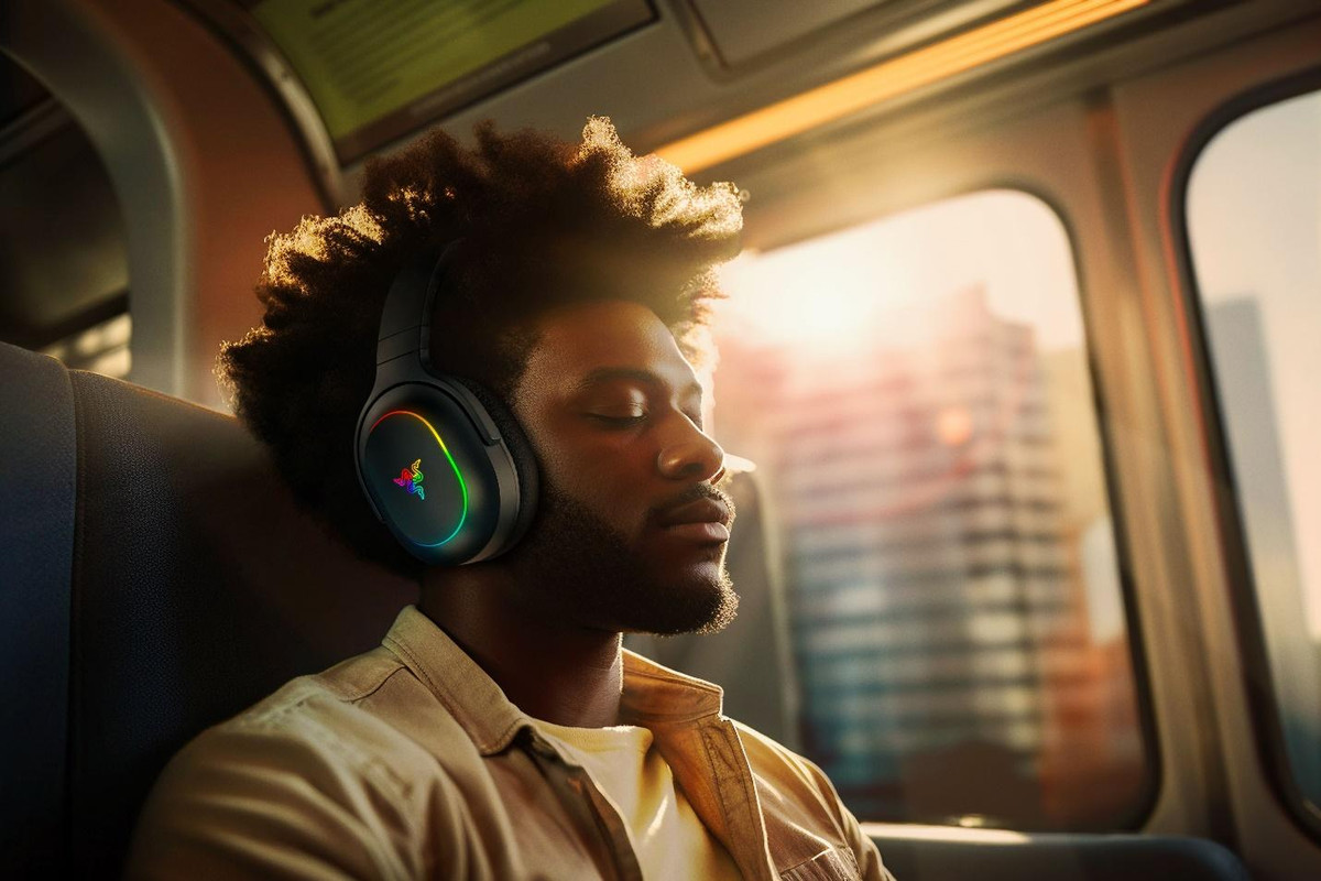 A person wearing headphonesDescription automatically generated A person wearing headphonesDescription automatically generated