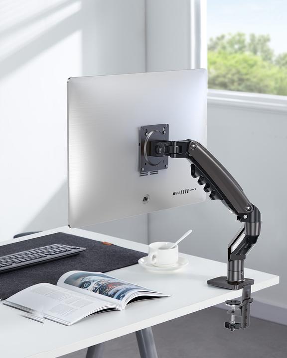HUANUO FlowLift monitor arm mounted on desk