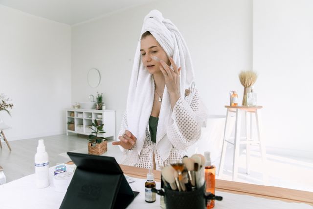 woman prepping her skin before fall makeup to kepp her skin soft, hydrated and comfortable for smooth foundation application 