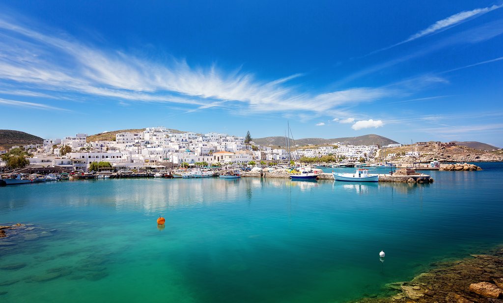 Whitewashed Cyclades island village with blue domed church