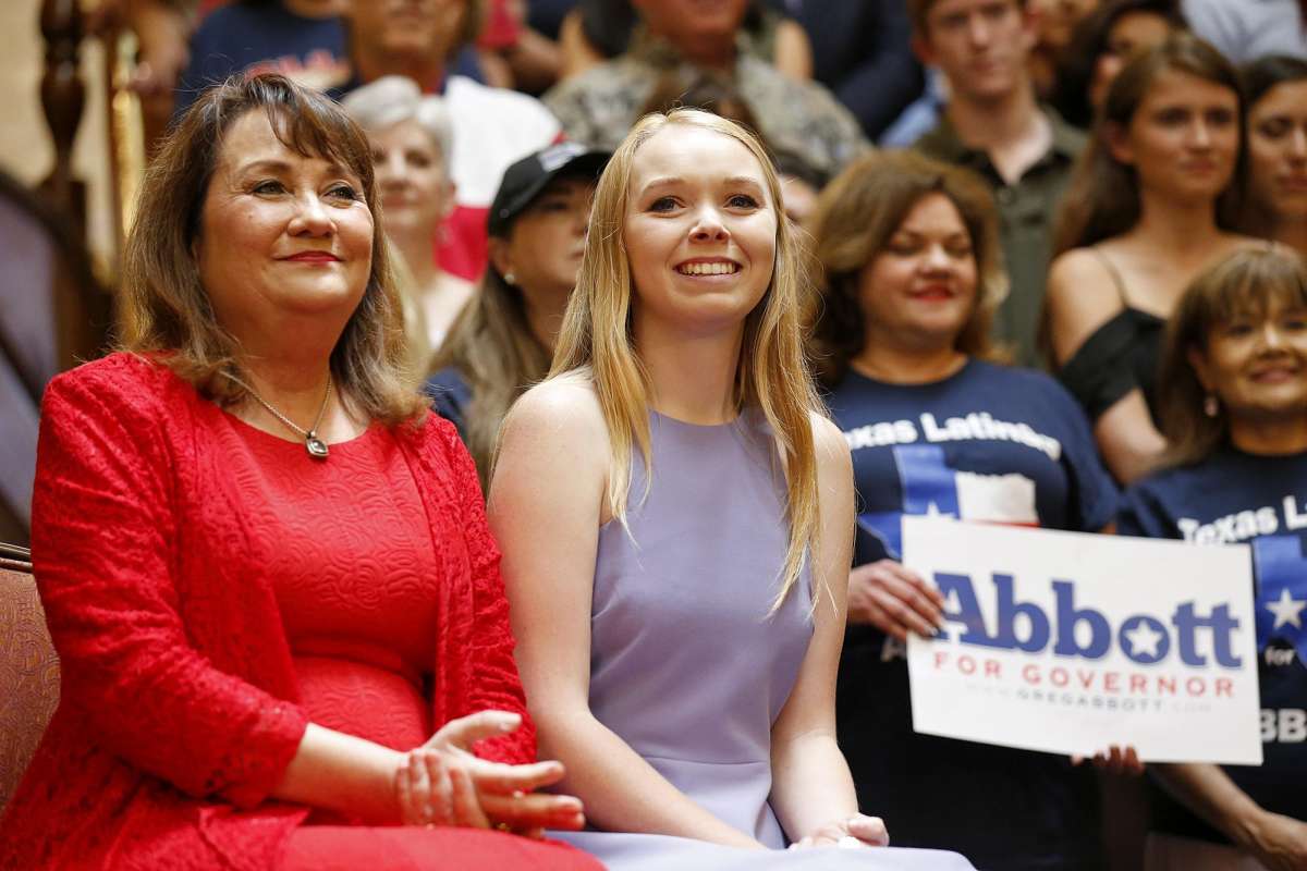 Audrey listens with her mother as Texas Gov. Greg Abbott announces his bid for re-election in 2017