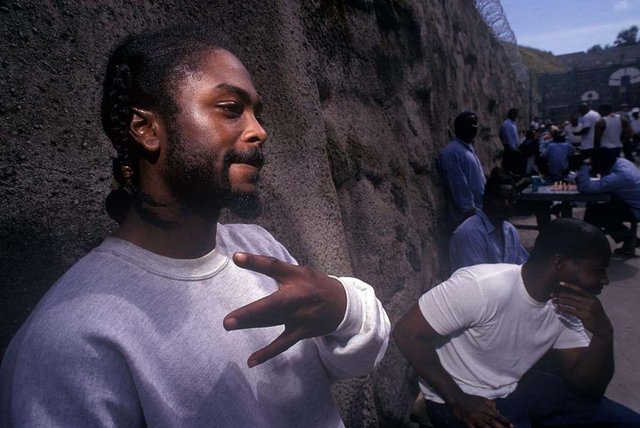 a-gang-member-throws-signs-in-old-folsom