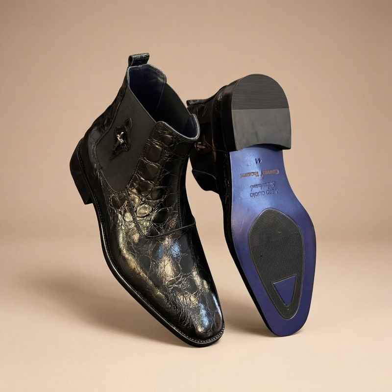 Luxury men's dress shoes in cognac leather displayed on wooden surface