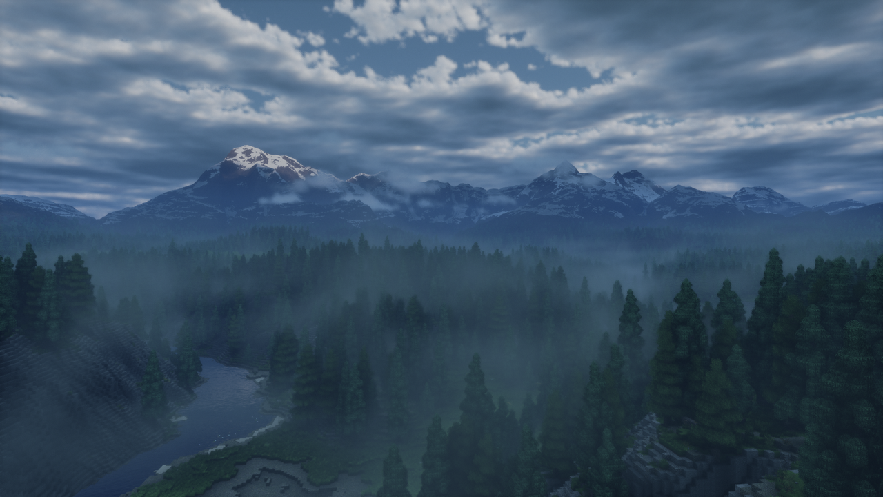 A foggy landscape of spruce and fir trees fading away into the Greater Vermance Mountains.