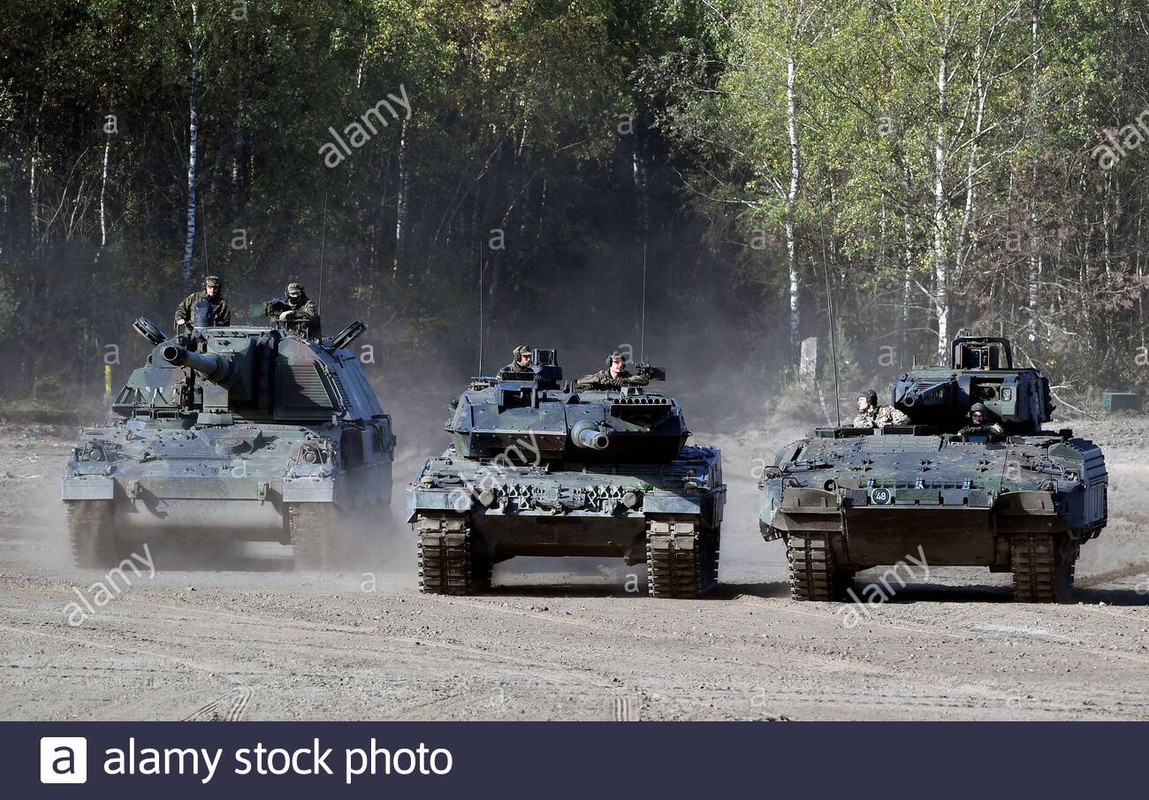 a-panzerhaubitze-2000-a-leopard-2-tank-and-a-puma-infantry-fighting-vehicle-l-r-of-german-army-bunde.jpg