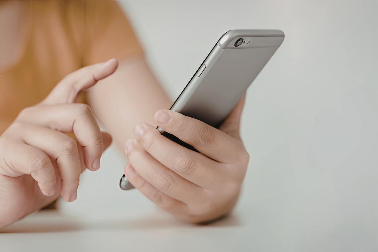 person scrolling on phone