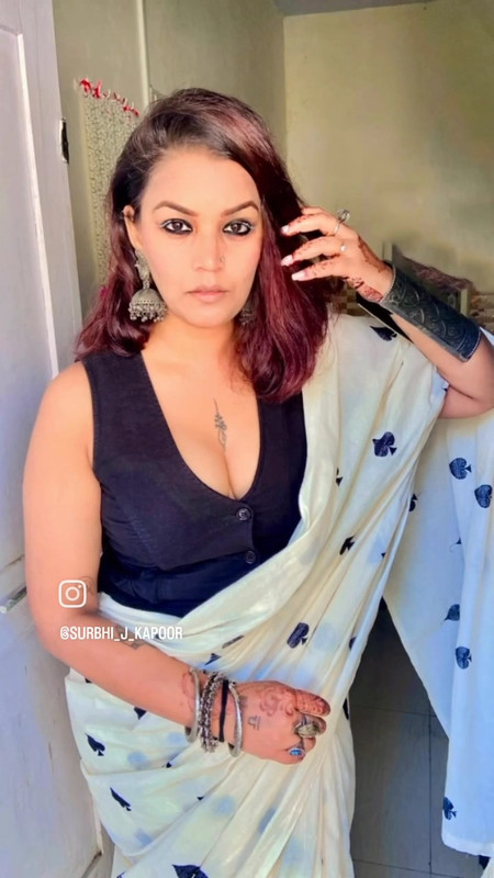 bengali lady big boobs and cleavage in black blouse and yellow saree.mp4_snapshot_00.41.550