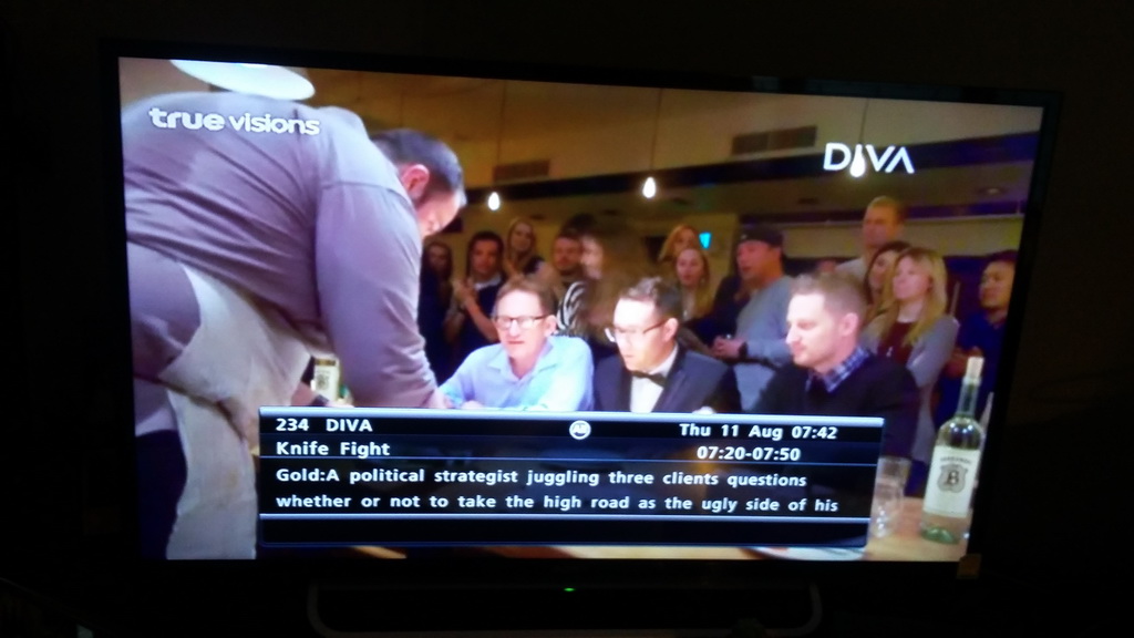 Same EPG synopsis as above over pictures of a Knife Fight contestant presenting his zatar crusted lamb belly
