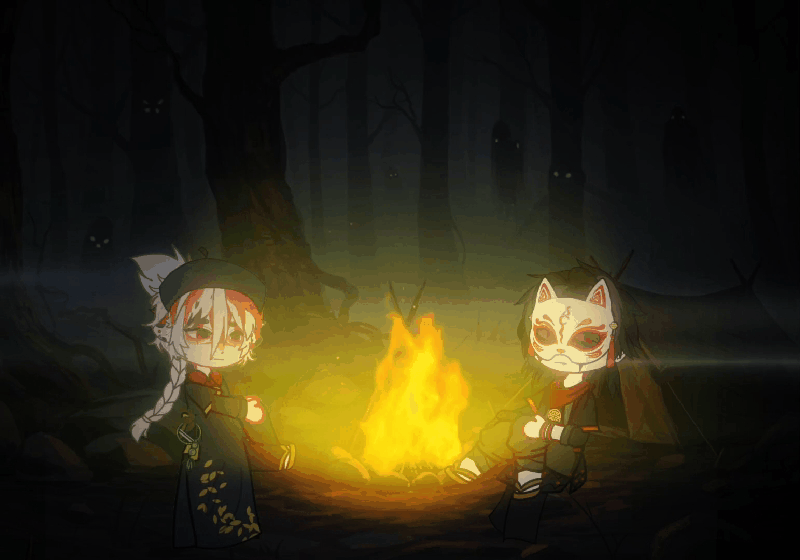 2 nhân vật ngồi cạnh đống lửa