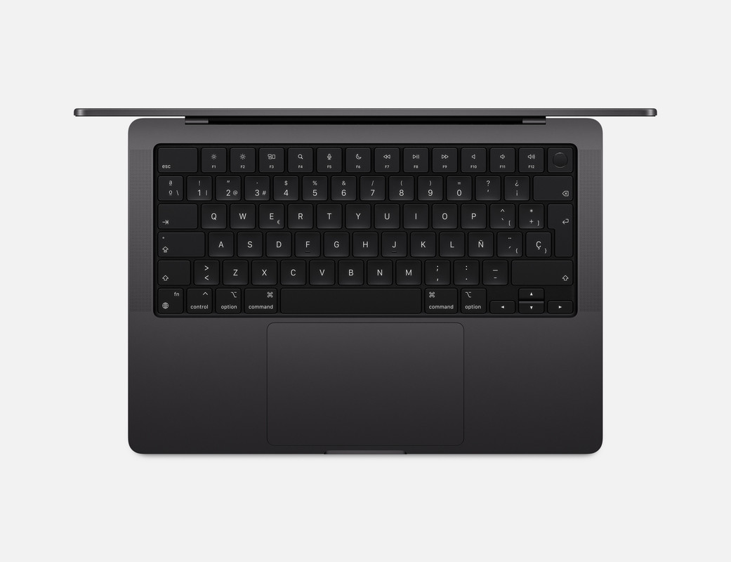 El teclado Magic Keyboard en español y los puertos del MacBook Pro.