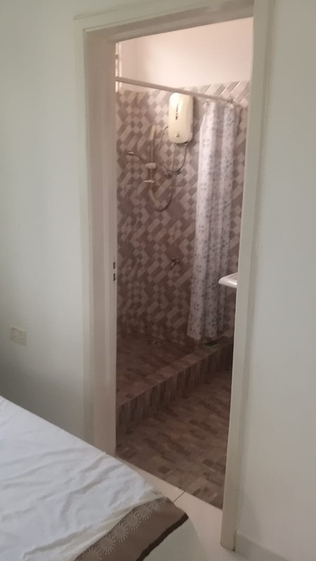 Kitchen and dining area in 1-bedroom Ola Estate apartment Cape Coast Ghana