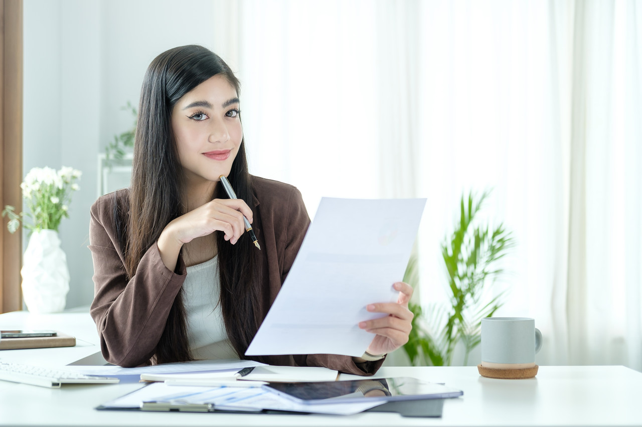 Businesswoman checking loan documents