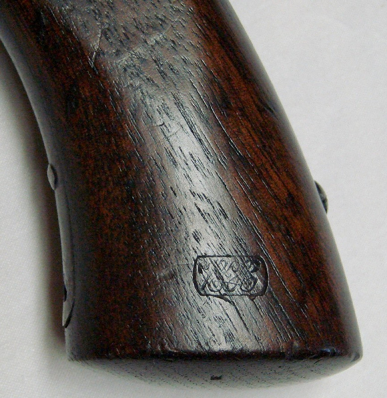 Cartouche on Starr Army left grip