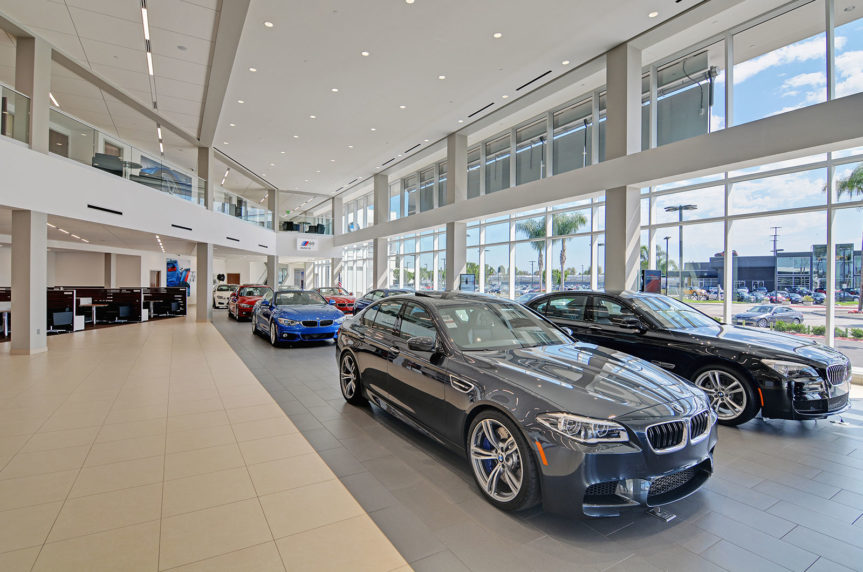 Automotive dealership showroom interior with high-end finishes and glass partitions — HKC project spotlight