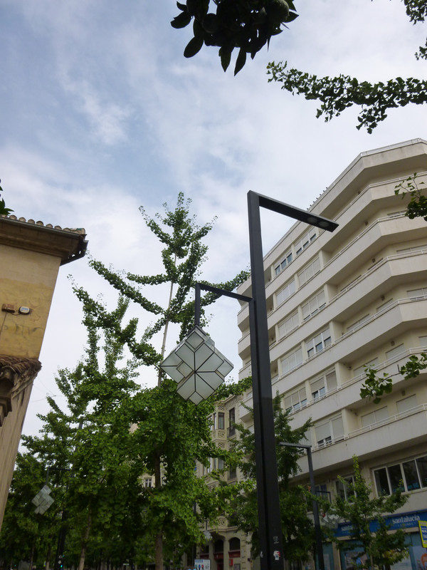 Modernist lamppost, the fitting around the bulb is a square broken down into smaller shapes.  It is both unusual looking and very cool.