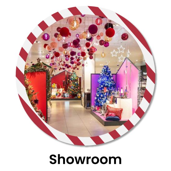 Christmas decorations for showroom featuring xmas tree adorned with glittering ornaments, ceiling lights and big ball hangings