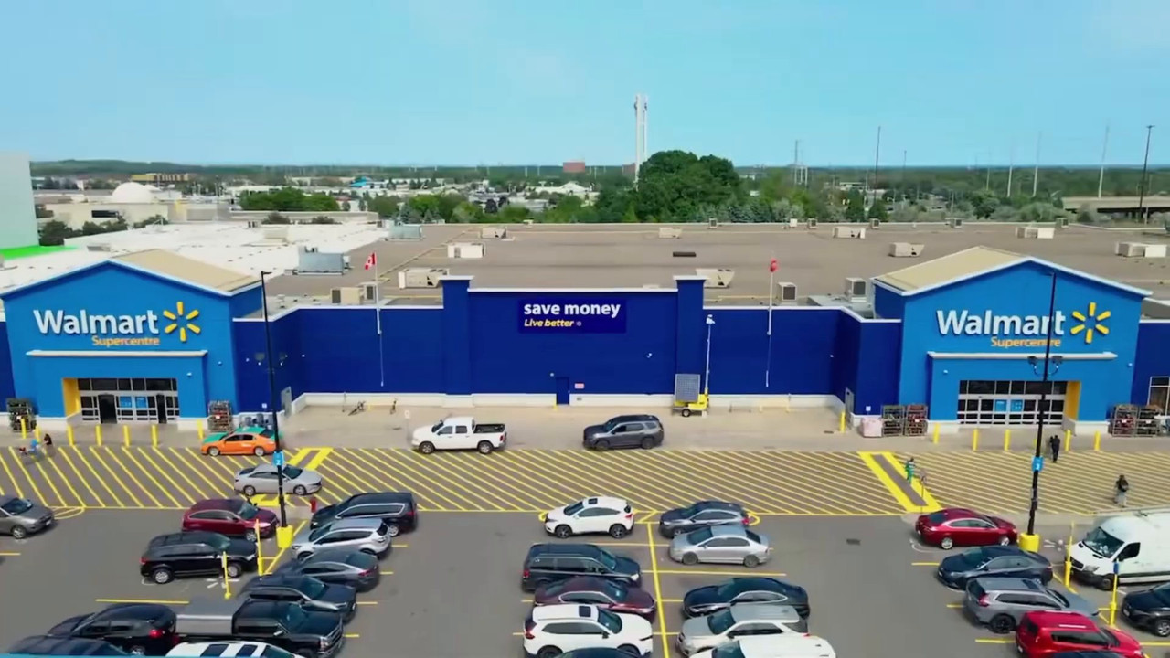 Aerial view of a Walmart Supercentre frontage and its freshly striped parking lot