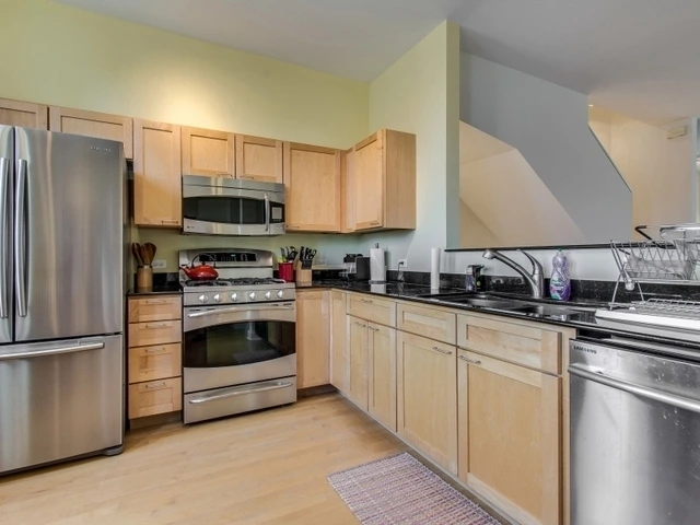 Kitchen with custom lighting and efficient storage solutions