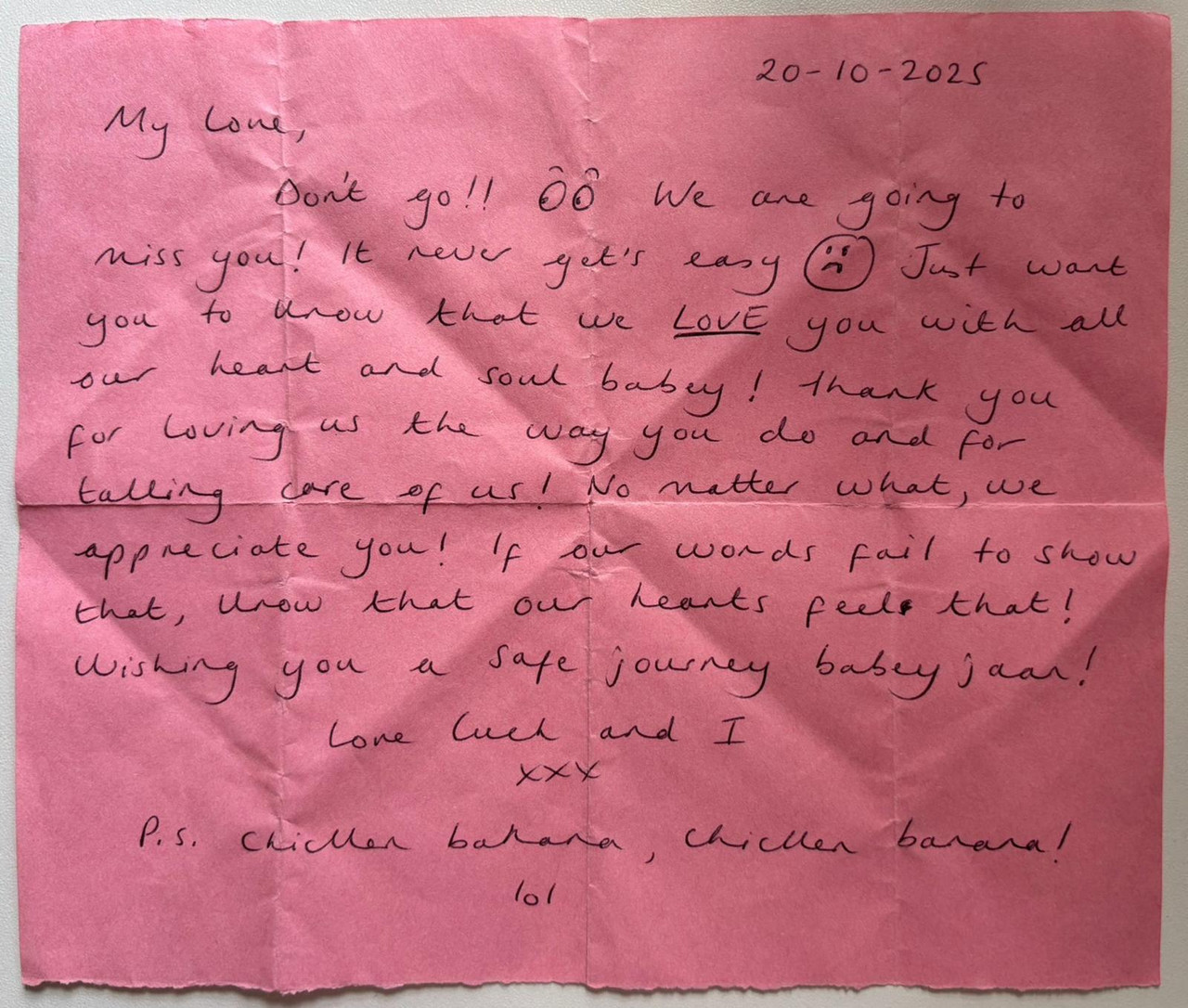 a handwritten note on pink paper, signed by luek and another person, addressed to jaan.