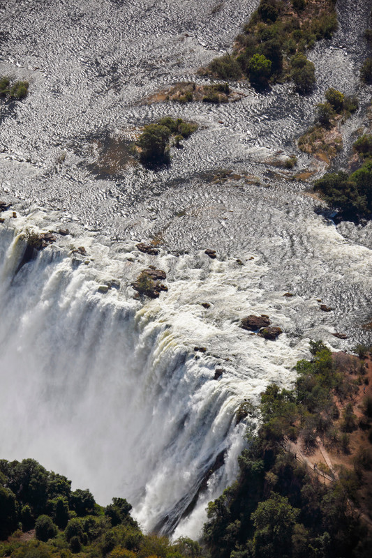 Close-up of Victoria Falls, cascading with mist and sunlight