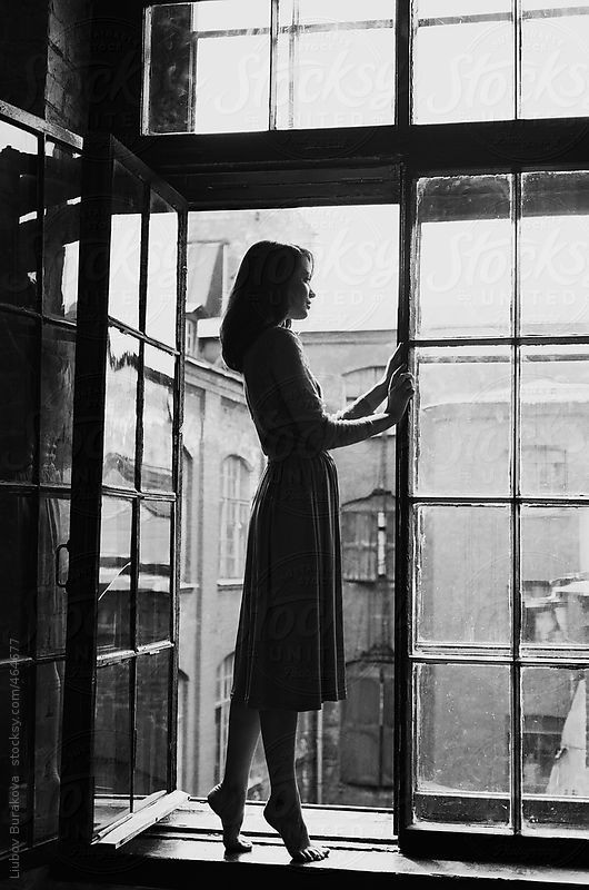 blacknwhitewomanatwindow.jpg