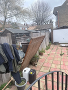 Fence installation before - dilapidated rear garden with old panels and overgrown patio