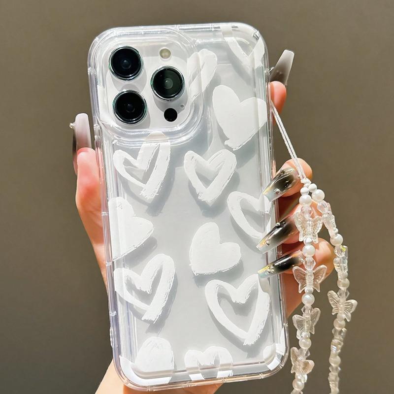 Foto de Funda transparente con diseño corazón. Incluye correa de mano.
